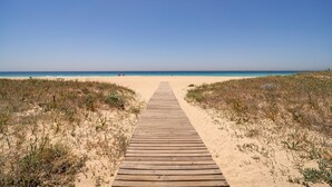 A wooden boardwalk leading to a beach with clear skies. - Awesome home in Tarifa with outdoor swimming pool (Tarifa)