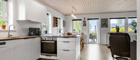 Fridge, stovetop, dishwasher, coffee/tea maker