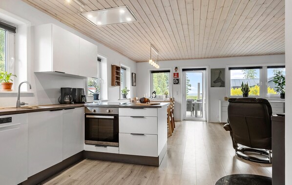 Fridge, stovetop, dishwasher, coffee/tea maker