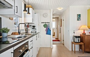 Fridge, stovetop, dishwasher, coffee/tea maker