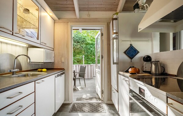 Fridge, stovetop, dishwasher, coffee/tea maker