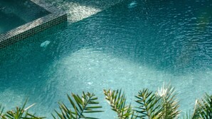 A clear view of a swimming pool with tiled edges and visible water clarity. - Bagaincha Resort & Spa (Pokhara)