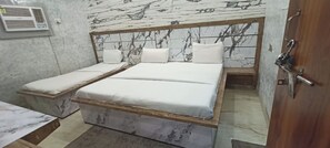 Deluxe Triple Room, City View | Soundproofing, bed sheets - Hotel Nand Palace Mathura (Mathura)