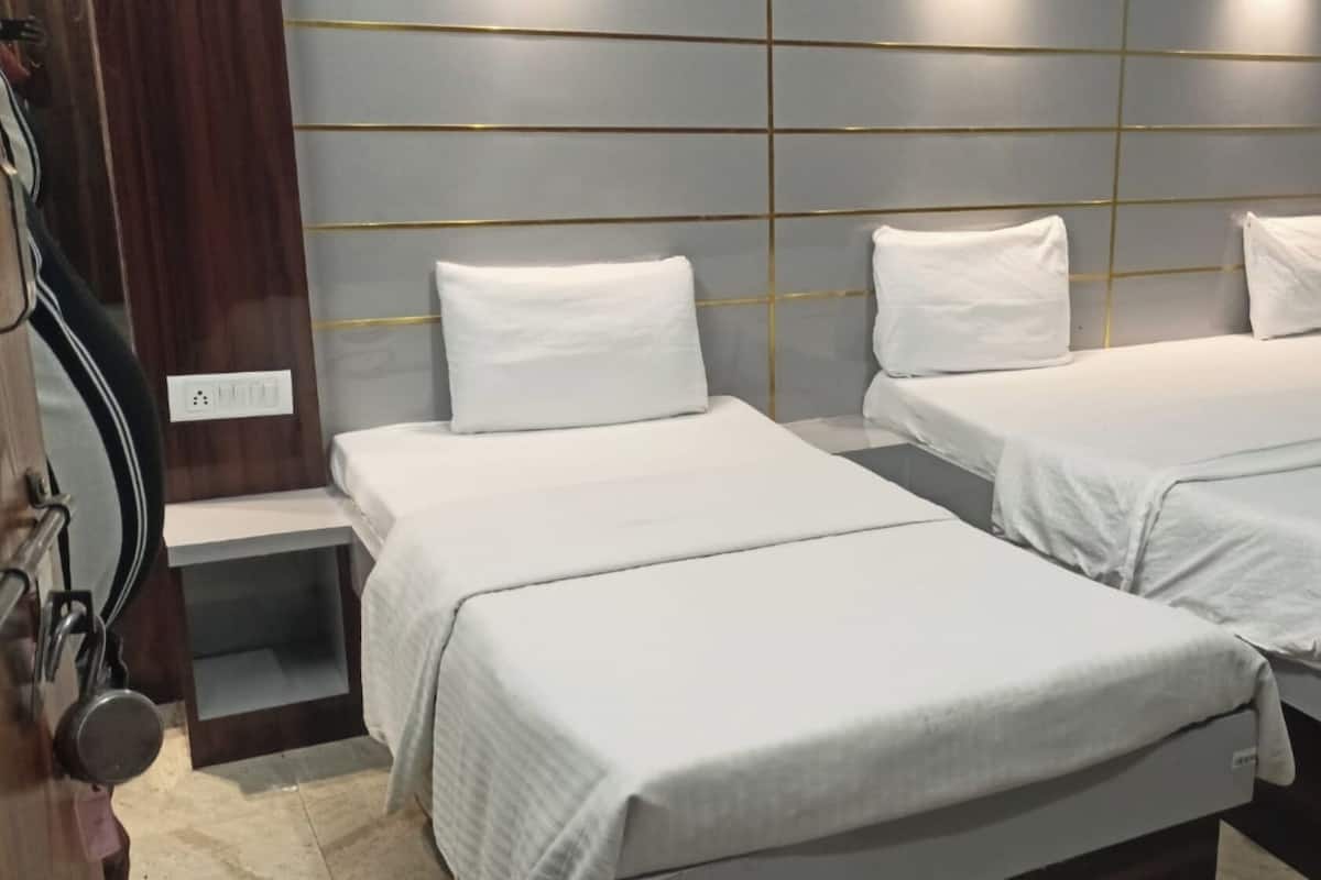 Chambre Triple Deluxe, vue ville | Chambres insonorisées, draps fournis