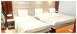 Deluxe Triple Room, City View | Soundproofing, bed sheets - Hotel Nand Palace Mathura (Mathura)
