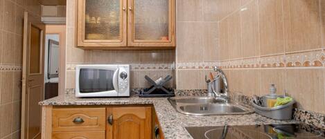 Fridge, microwave, toaster, cookware/dishes/utensils