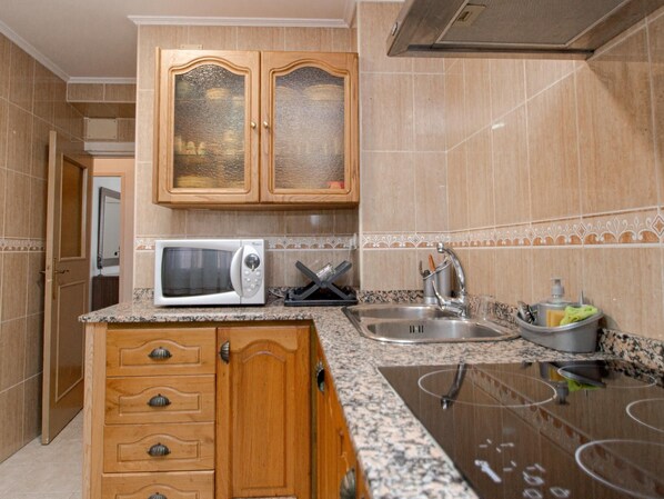 Fridge, microwave, toaster, cookware/dishes/utensils