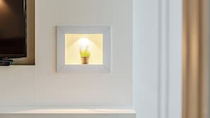 A framed potted plant with a light source behind it, mounted on a wall above a white counter. - Gyeongju Nollowa Spa Pension (Gyeongju)