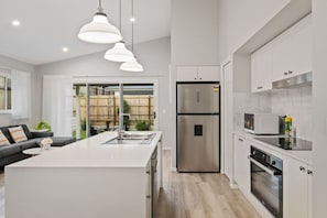 Fridge, microwave, oven, stovetop - Newly Built 4BR Family Oasis | Comfort & Space (Logan Reserve)