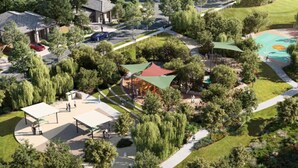 An aerial view of a park with a playground, walking paths, and covered seating areas. - Newly Built 4BR Family Oasis | Comfort & Space (Logan Reserve)
