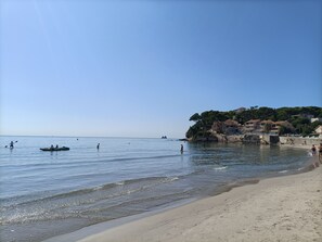 On the beach, sun loungers, beach towels