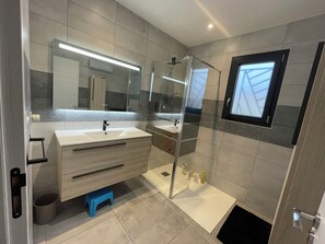 Shower, hair dryer, towels, soap