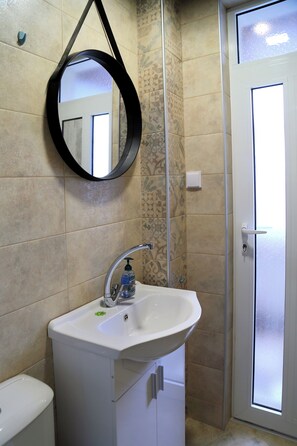 Shower, hair dryer, towels, soap