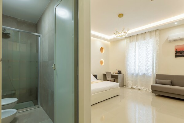 Superior Quadruple Room, City View | In-room safe, desk, laptop workspace, iron/ironing board