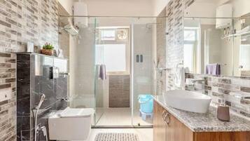 Shower, free toiletries, slippers, towels