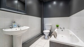 A modern bathroom with a pedestal sink, toilet, and a freestanding bathtub. - Crookesmoor View, Sheffield (South Yorkshire)