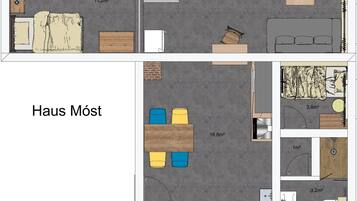Een plattegrond van een hotelkamer met een bed, een bureau, een stoel, een kleine tafel, een bank en een badkamer.