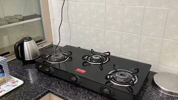 Fridge, stovetop, toaster, cookware/dishes/utensils