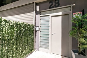 Enter a secure unit at 28, surrounded by lush greenery.