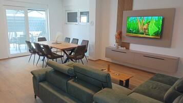 Standard House, Balcony, Partial Sea View | Living area | 100-cm LCD TV with satellite channels