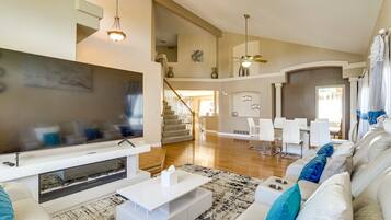 Smart TV, fireplace, books, stereo