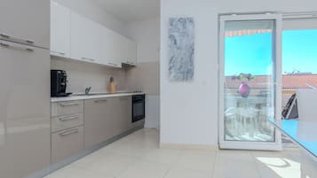 Standard Apartment, Garden View | Private kitchen | Espresso maker, electric kettle, toaster, high chair