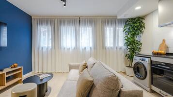 Apartment, 2 Bedrooms | Living area | 50-cm TV with cable channels