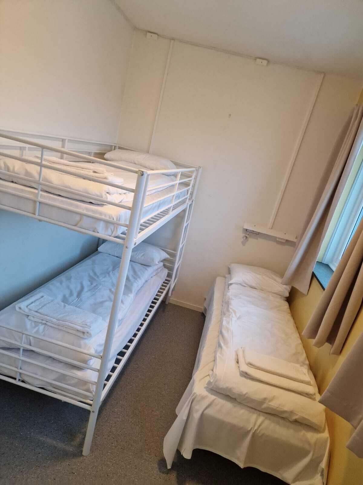 Basic Triple Room, Partial Ocean View | Desk, free WiFi, bed sheets