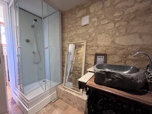 Shower, hair dryer, towels, toilet paper