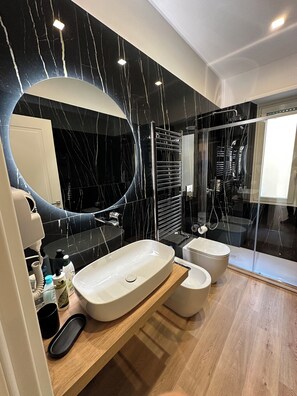 Hair dryer, bidet, towels, soap