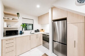 Coffee/tea maker, fridge, microwave, oven