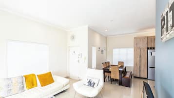 Superior Villa, Garden View | Living area | TV