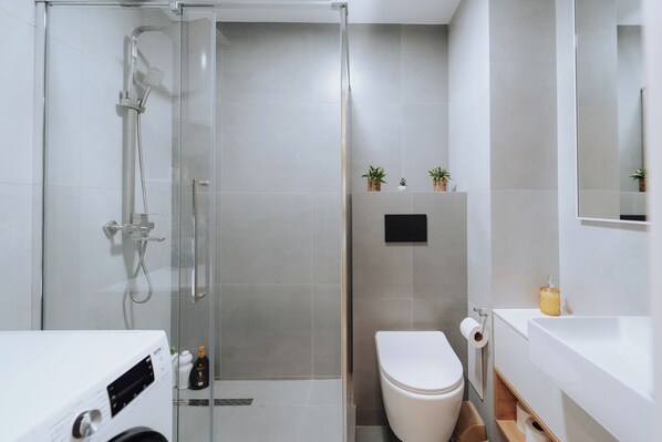 Shower, hair dryer, towels, soap