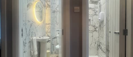 Shower, hair dryer, towels, soap