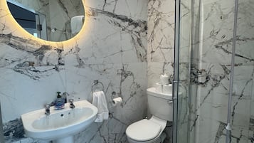 Shower, hair dryer, towels, soap