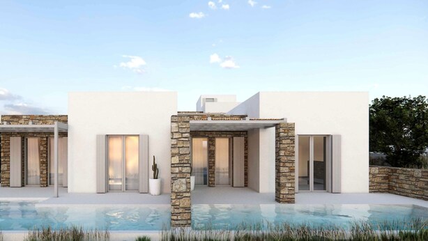 A modern house with a pool, stone pillars, and white walls. - 2-bedroom Villa Kalypso (Antiparos)