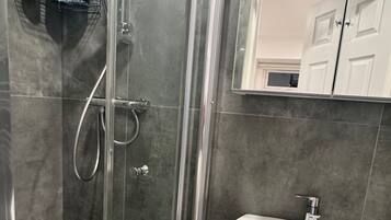 Shower, hair dryer, towels, soap