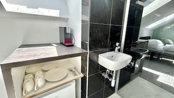 Shower, hair dryer, towels, toilet paper