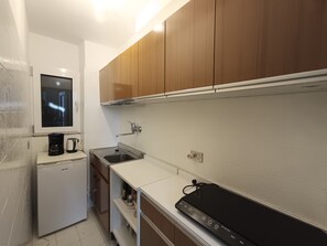 Fridge, stovetop, coffee/tea maker, dining tables