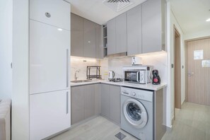 Fridge, microwave, stovetop, coffee/tea maker