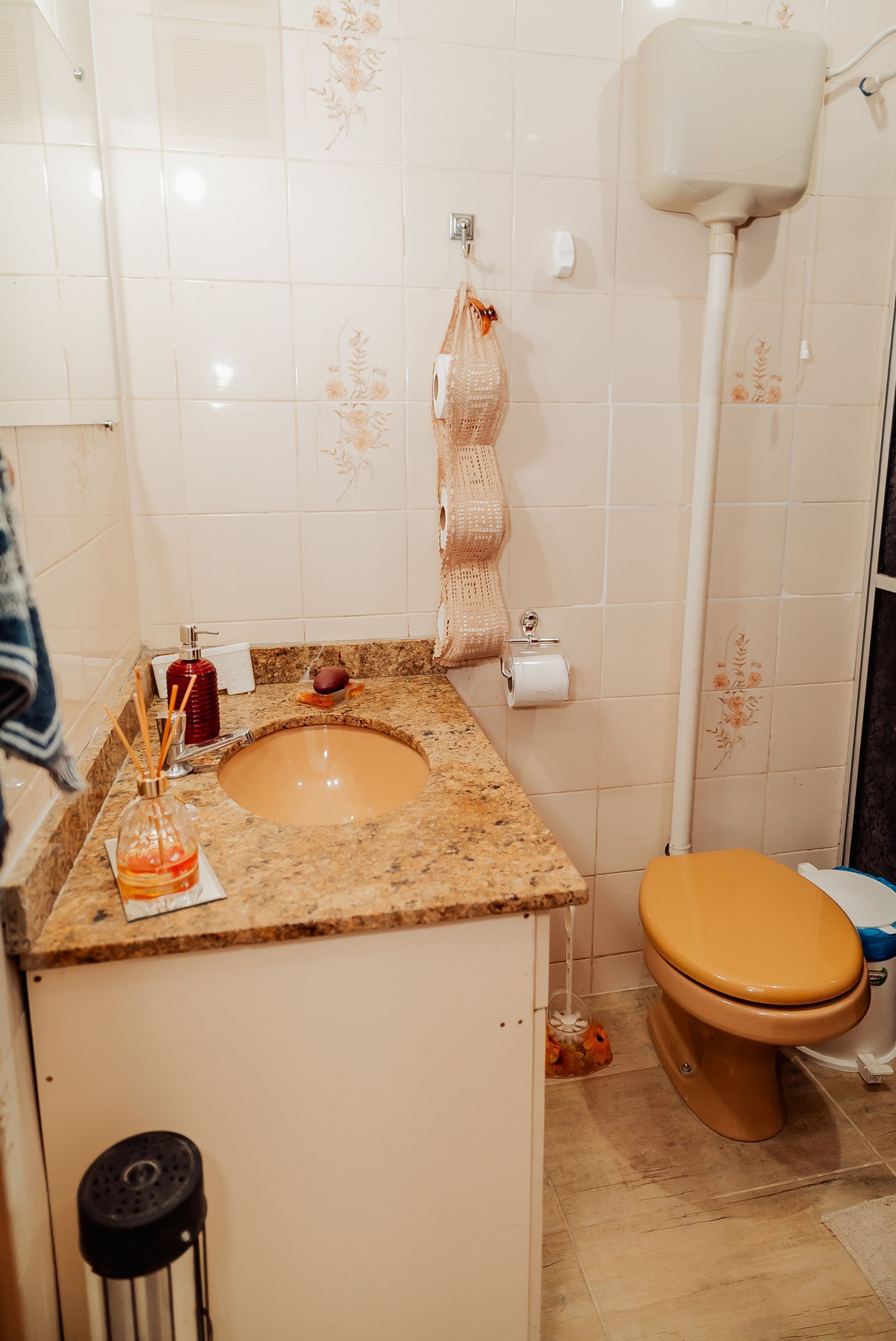 A bathroom with a sink, toilet, and shower.