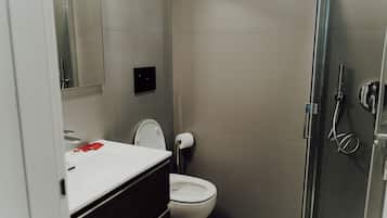 Shower, bidet, towels, soap