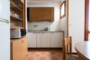 Fridge, microwave, high chair, cookware/dishes/utensils