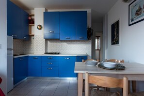 Fridge, microwave, high chair, cookware/dishes/utensils