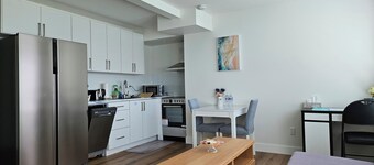 Private south-facing suite with a full bathroom and fully equipped kitchen.