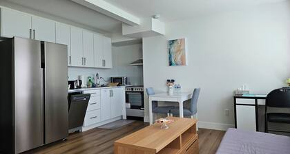 Private south-facing suite with a full bathroom and fully equipped kitchen.