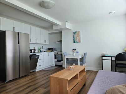 Private south-facing suite with a full bathroom and fully equipped kitchen.