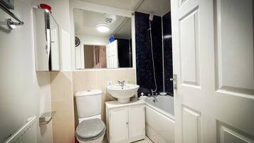 Shower, towels, soap, toilet paper
