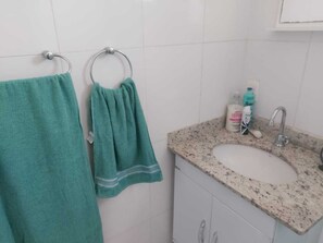 Shower, hair dryer, towels, toilet paper