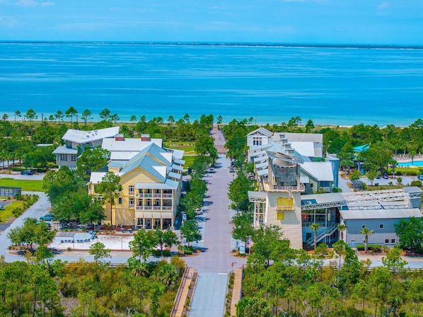 A coastal resort with multiple buildings, a central walkway, and a view of the ocean. - Salty Beaches (Port St. Joe)